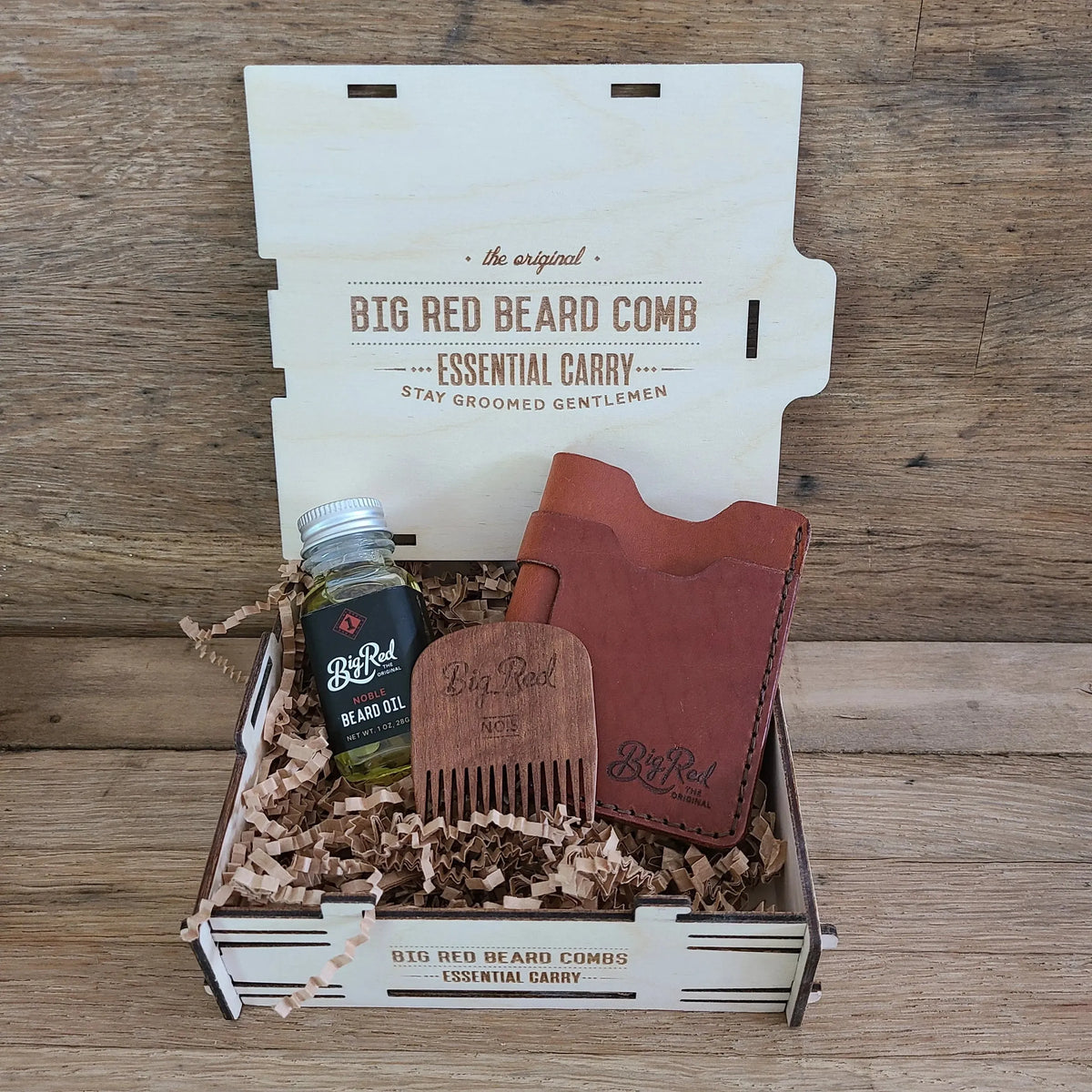 Big Red Essential Carry beard grooming kit with beard oil, wooden No. 5 comb, and leather wallet in a branded gift box