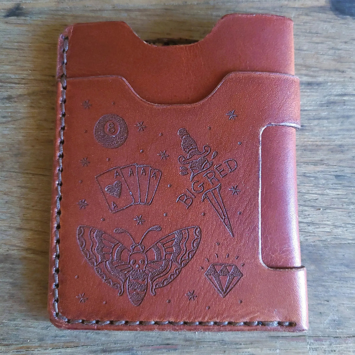 Back of Big Red Tattoo Minimalist Wallet in full-grain English Tan leather with engraved tattoo artwork